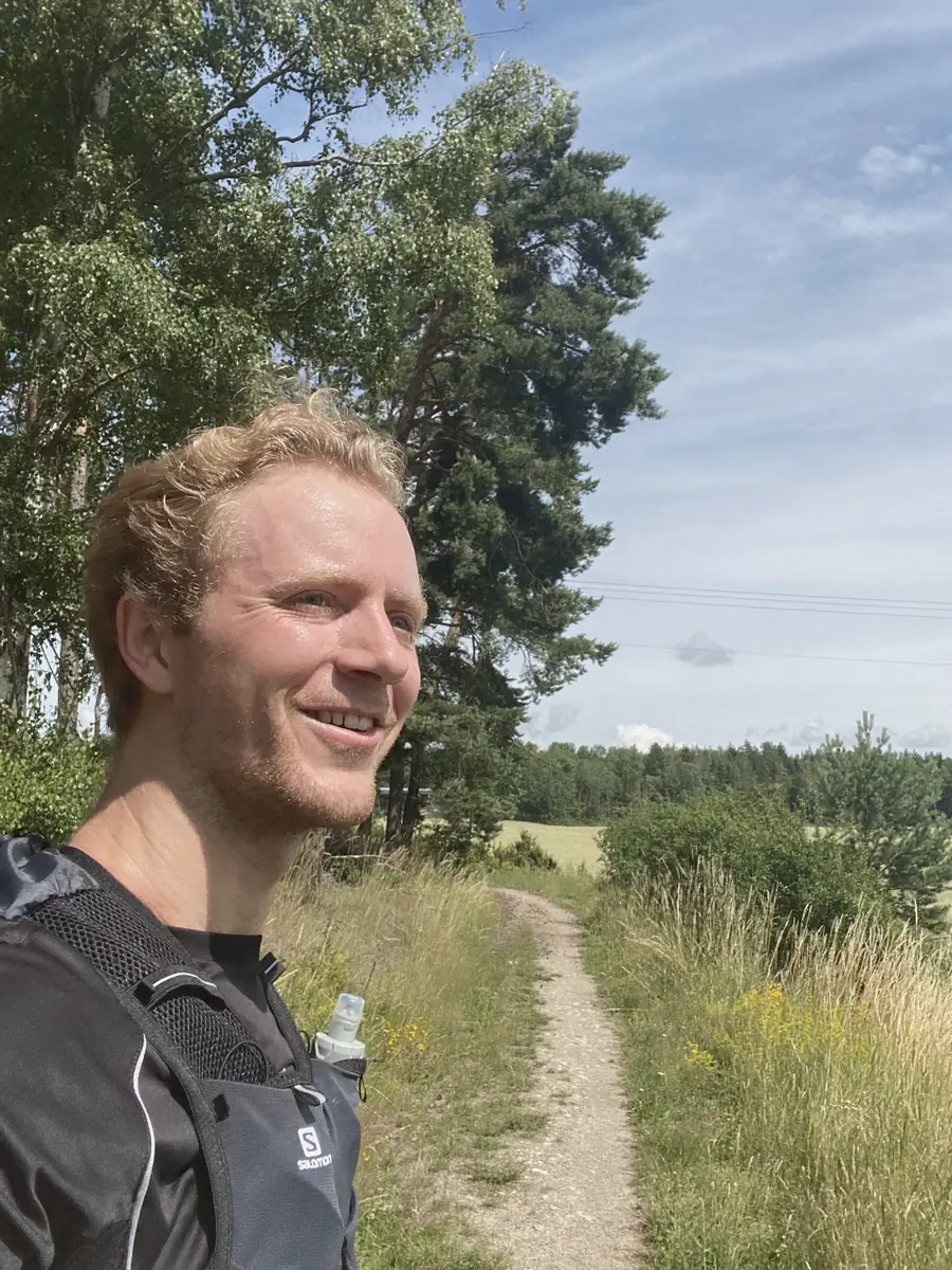 Oscar Linger out running on a forest trail.